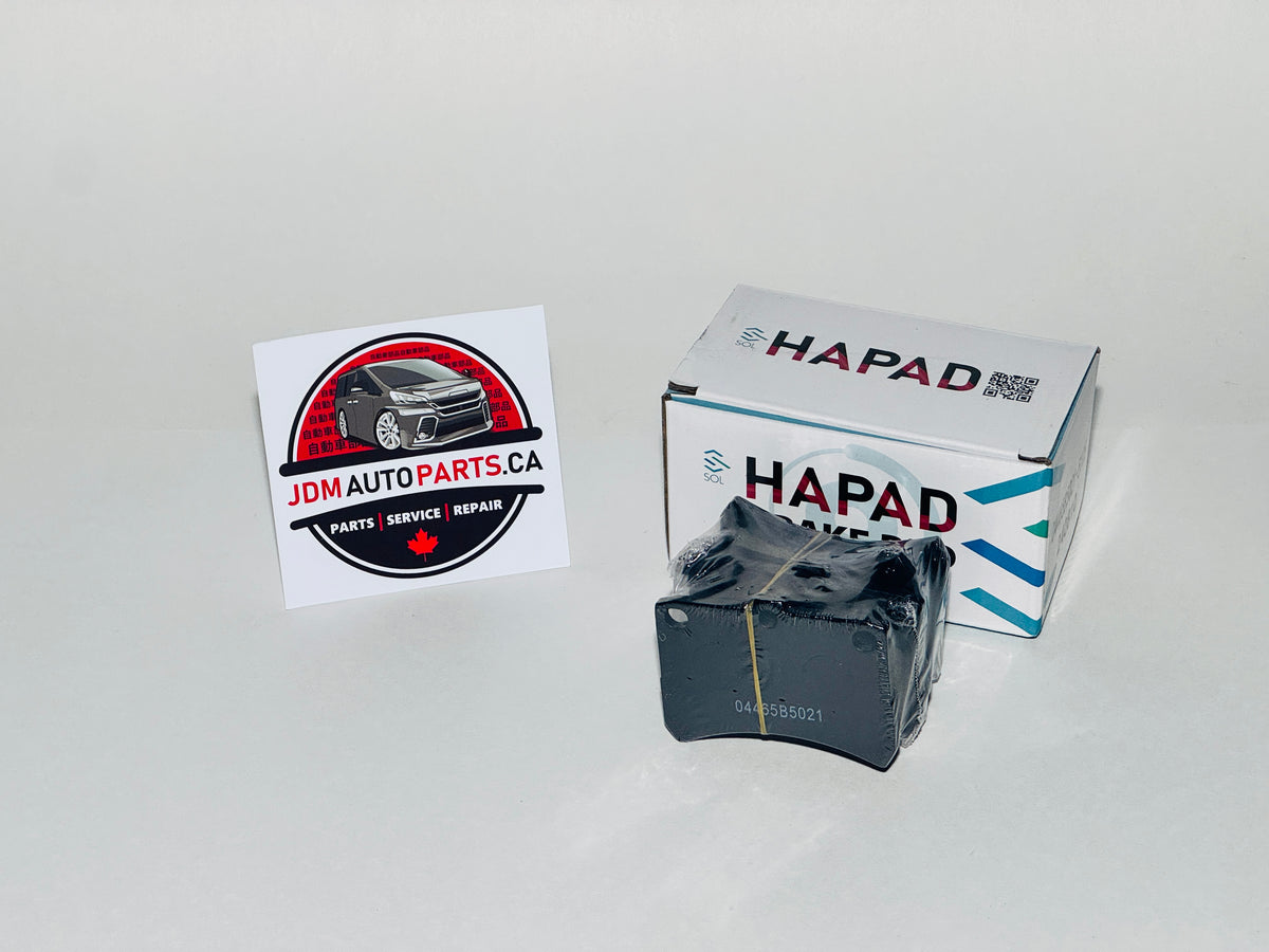 Car brake pads with HAPAD branding and JDM Auto Parts CA logo on a white background