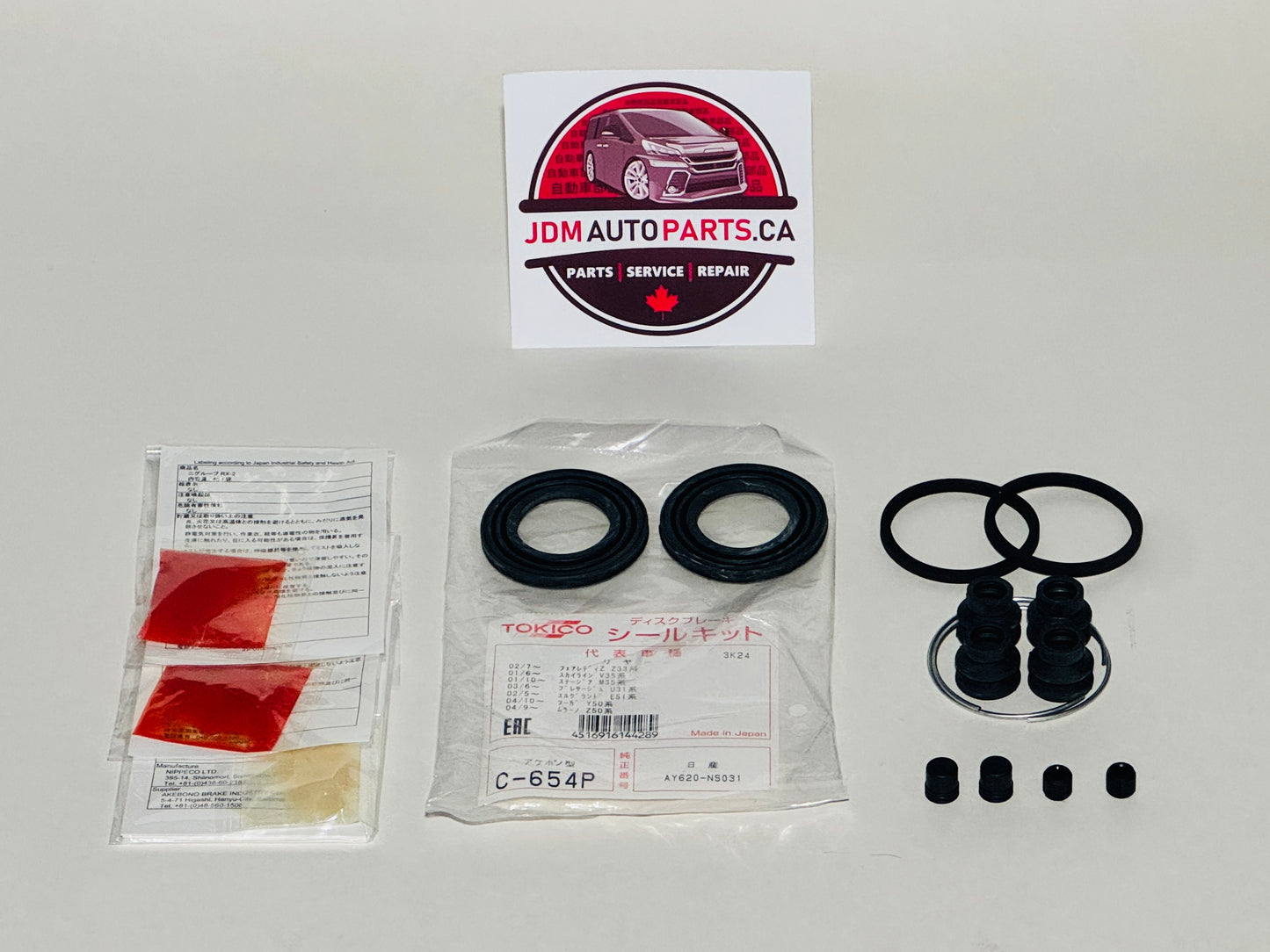 Automotive parts including seals and gaskets with JDM Auto Parts CA branding on a white background.