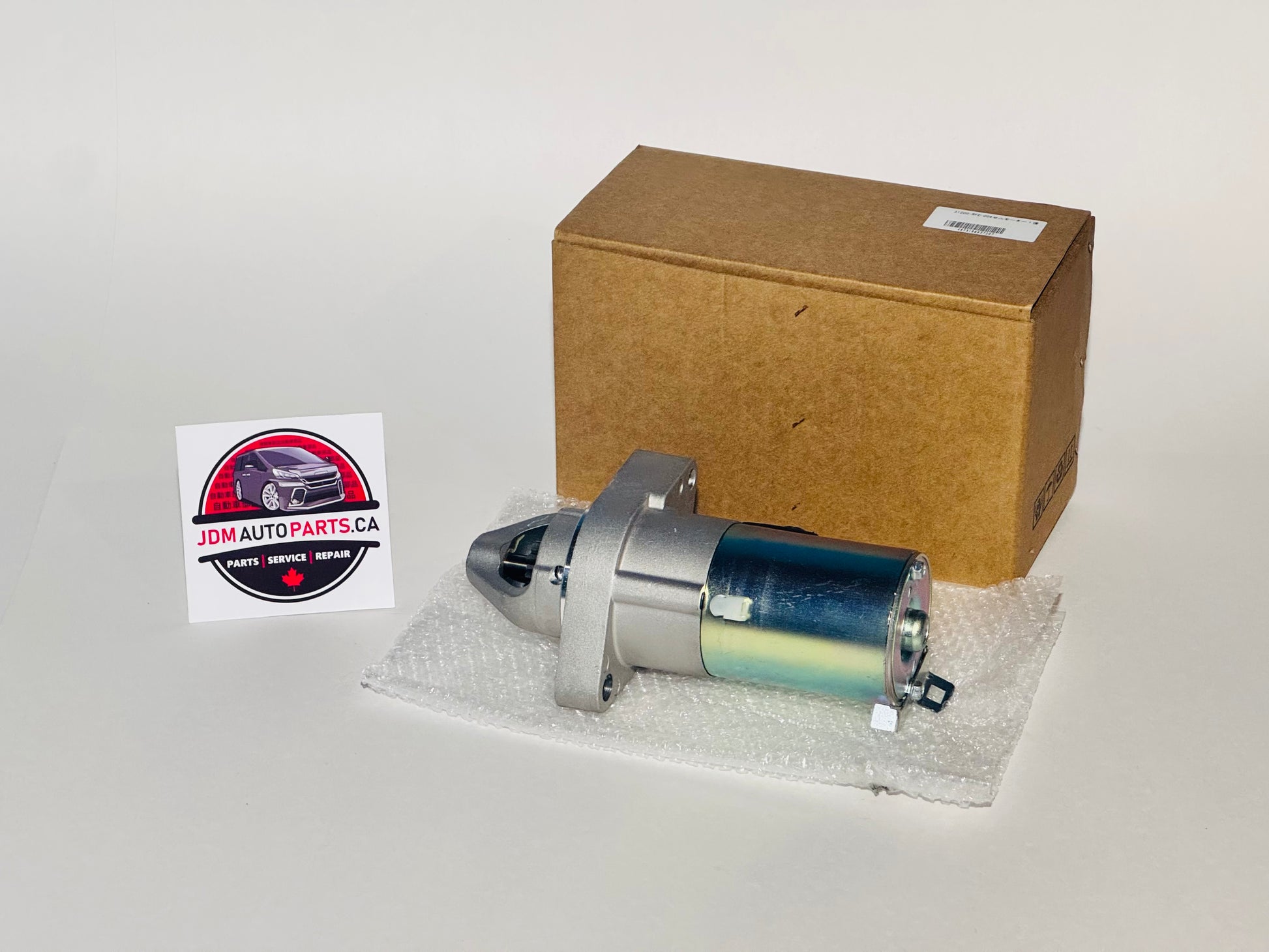 starter motor for jdm honda odyssey rb1 and rb2 models with jdmautoparts.ca logo 