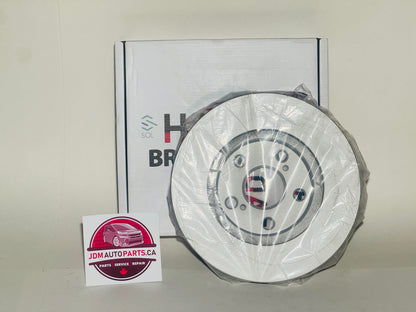 Car brake disc with packaging and JDM Auto Parts Canada logo in the background
