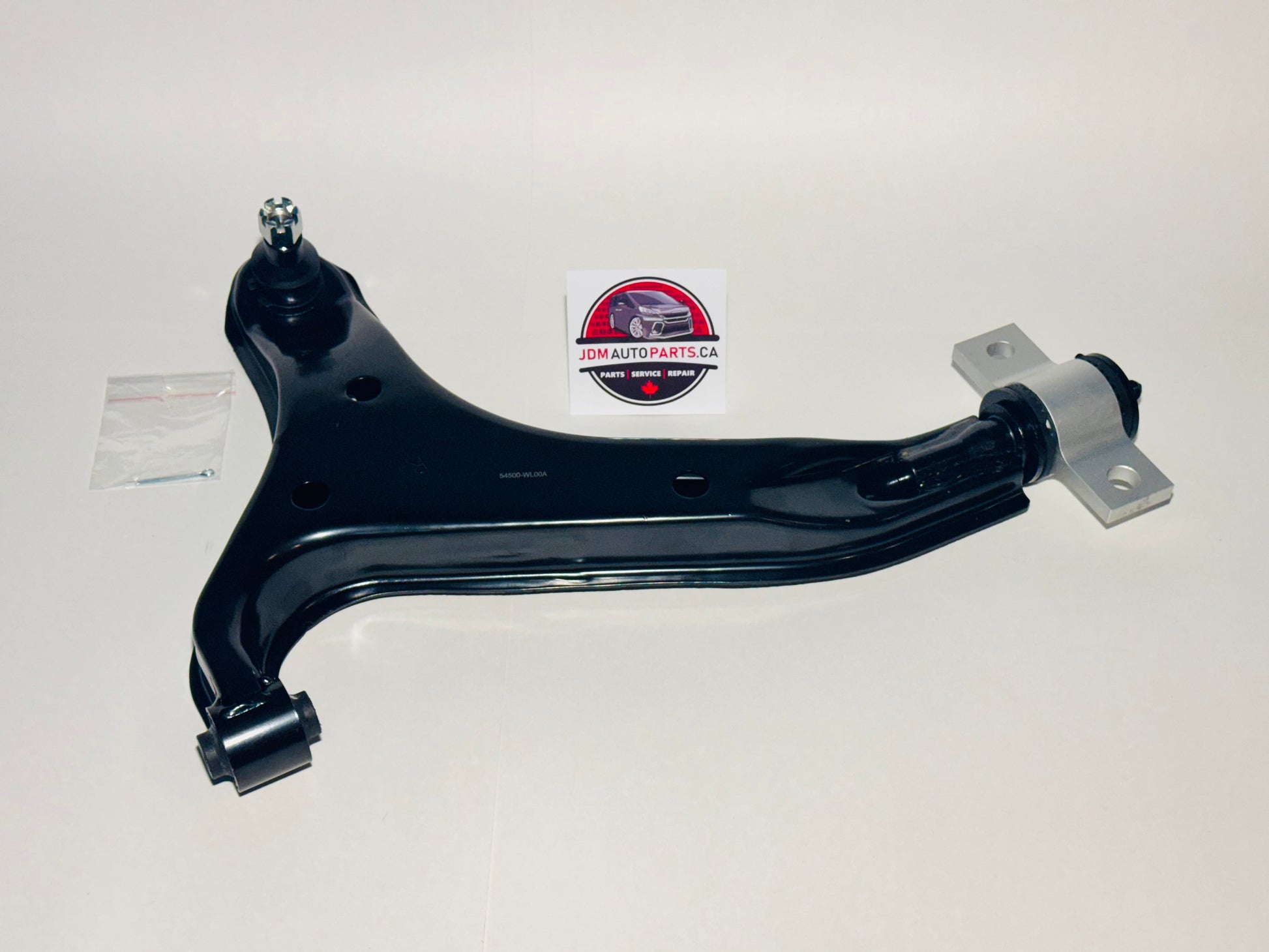 A black lower control arm for a Nissan Elgrand, displayed on a neutral background with a visible logo in the top right corner.
