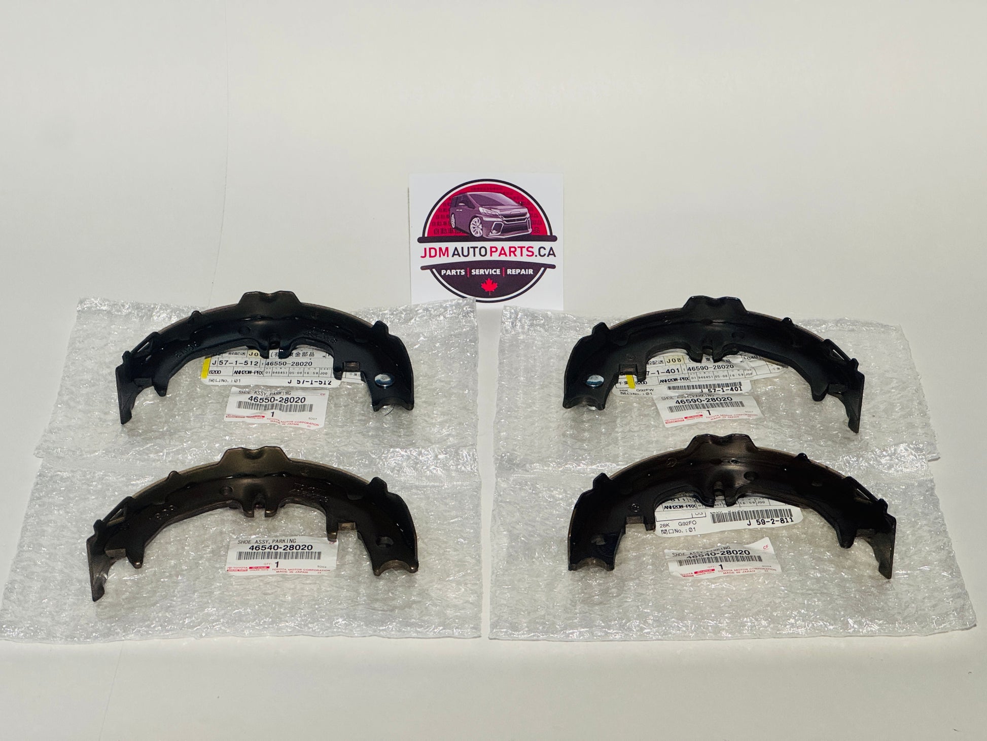 Four black brake shoes on a white background with JDM Auto Parts CA logo.