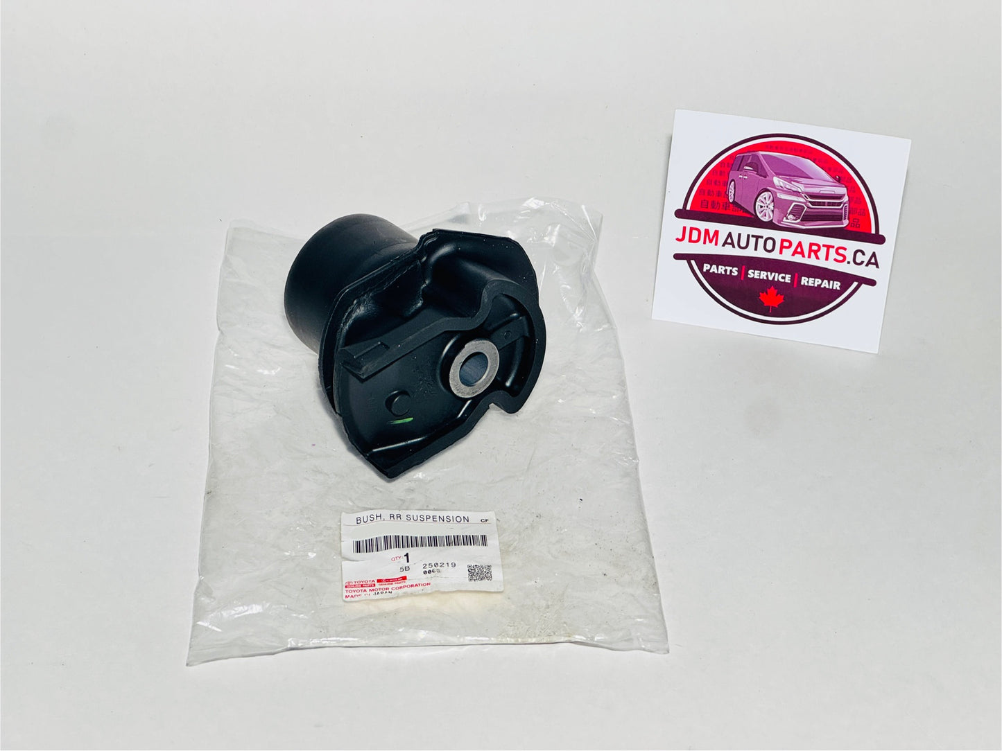 Black rear trailing arm bushing for toyota alphard and vellfire models in clear packaging with JDM Auto Parts CA label on a white background