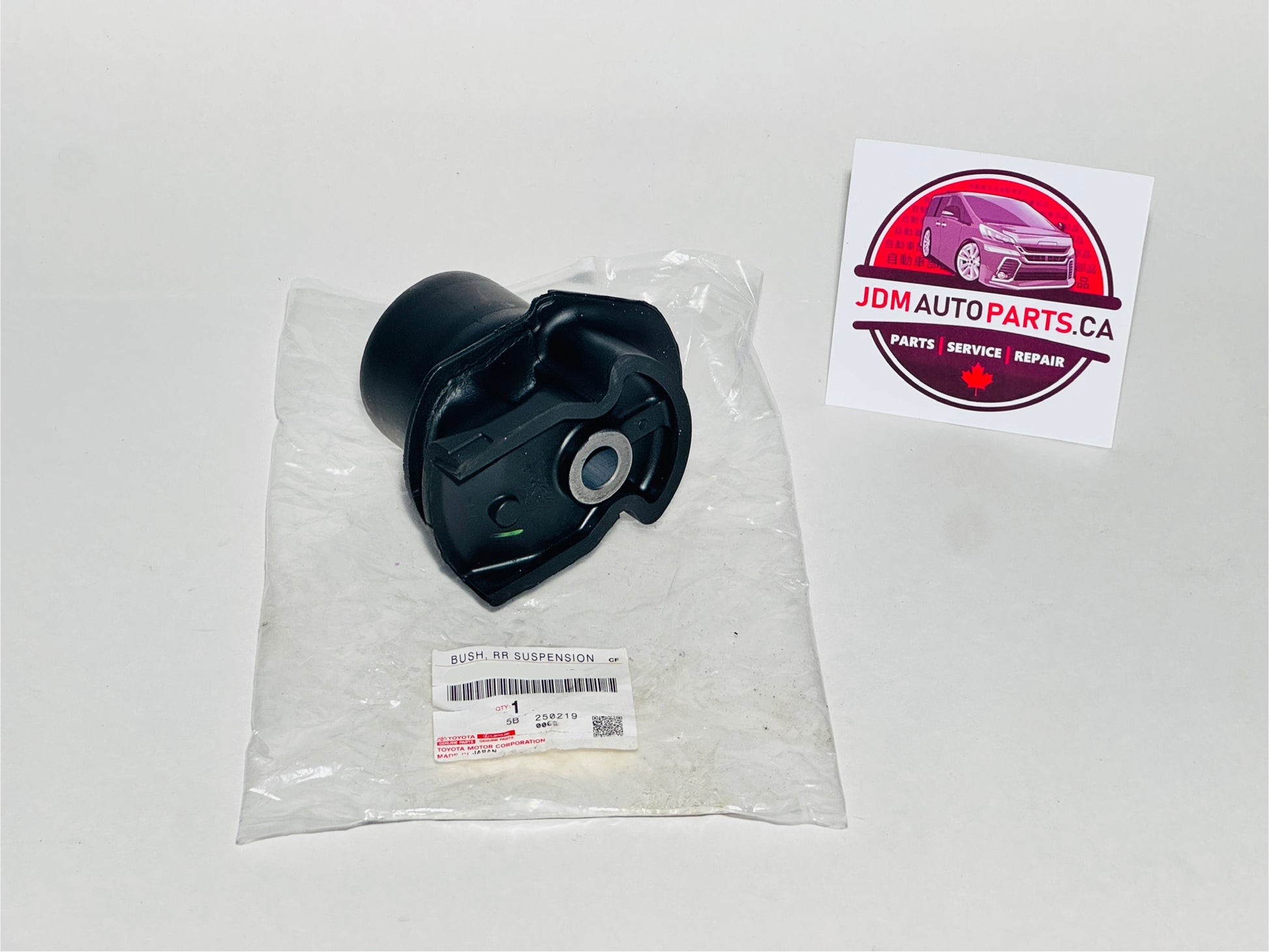 Black rear trailing arm bushing for toyota alphard and vellfire models in clear packaging with JDM Auto Parts CA label on a white background